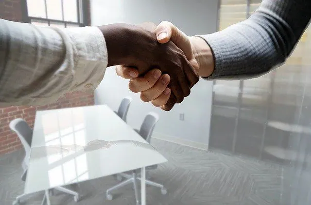 Handshake illustrating that anonymizing resumes can lead to a diverse, well balanced workplace and valuable hires you might have otherwise missed. 